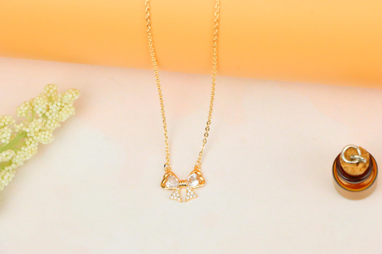 Rose Gold Bow Necklace with Heart-Shaped Crystals and Pavé Detail, XPNL1888 (2160-1)