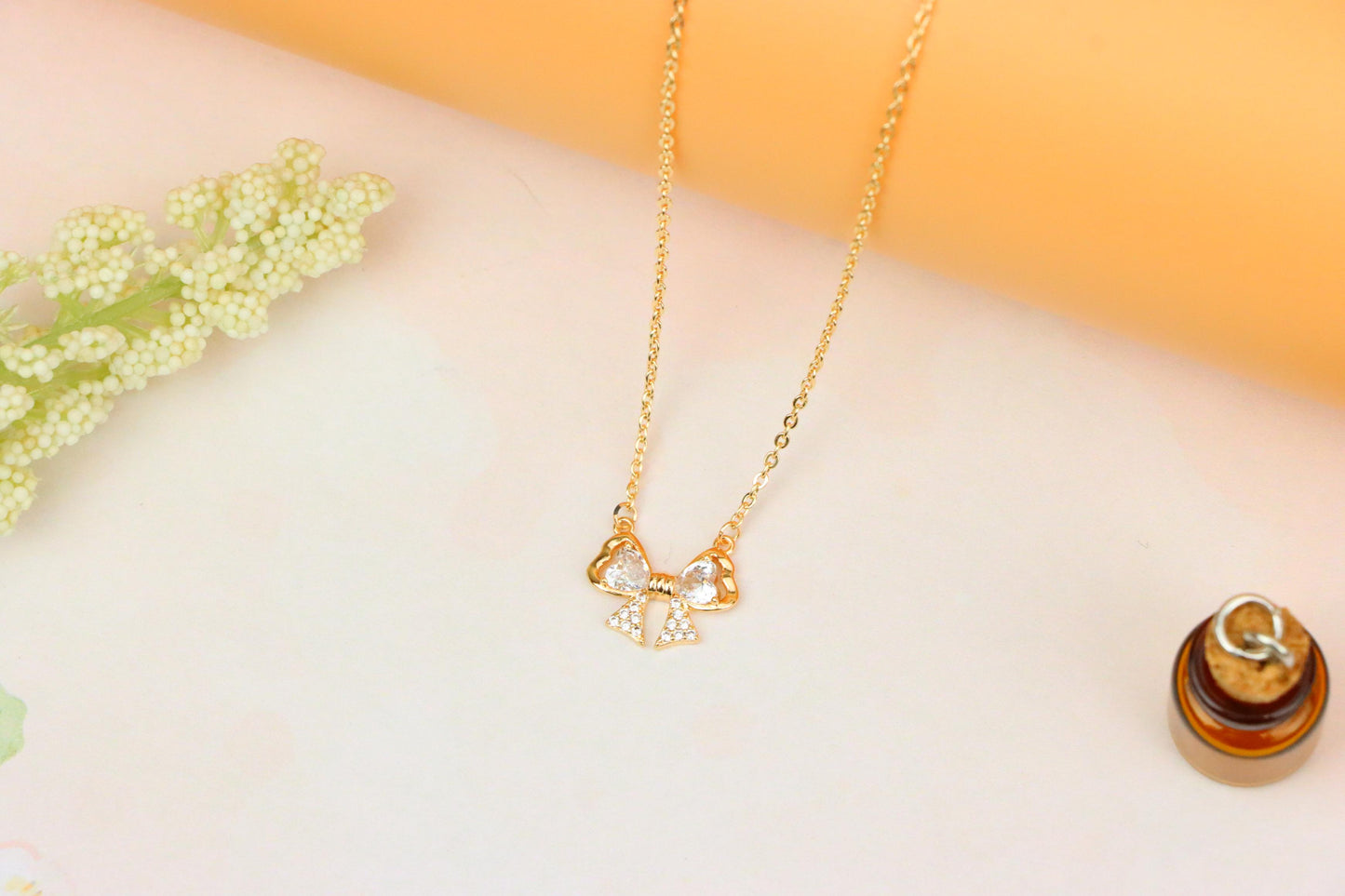 Rose Gold Bow Necklace with Heart-Shaped Crystals and Pavé Detail, XPNL1888 (2160-1)