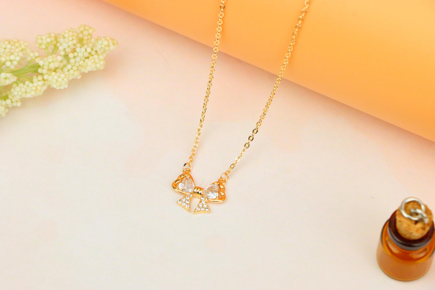 Rose Gold Bow Necklace with Heart-Shaped Crystals and Pavé Detail, XPNL1888 (2160-1)