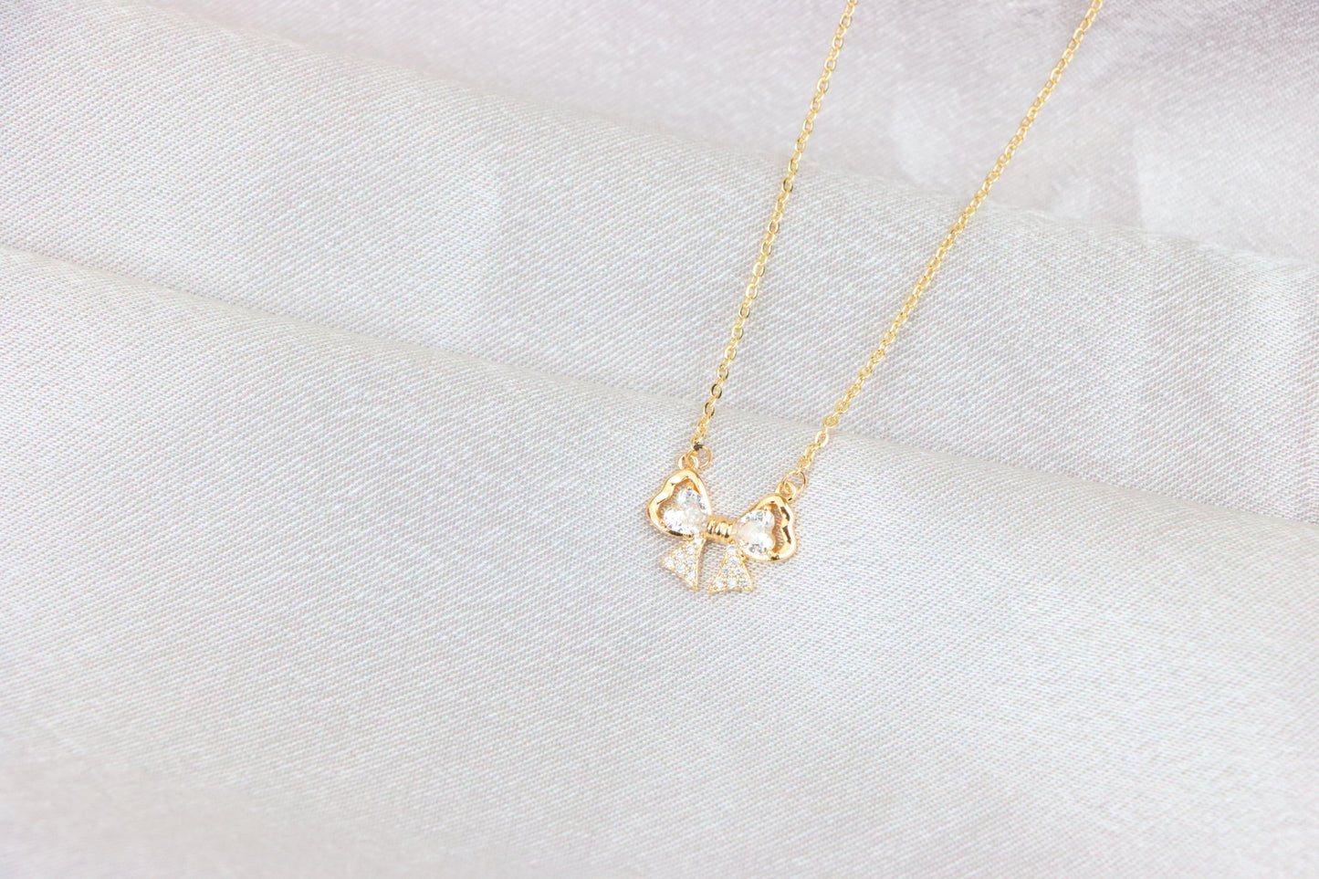 Rose Gold Bow Necklace with Heart-Shaped Crystals and Pavé Detail, XPNL1888 (2160-1)