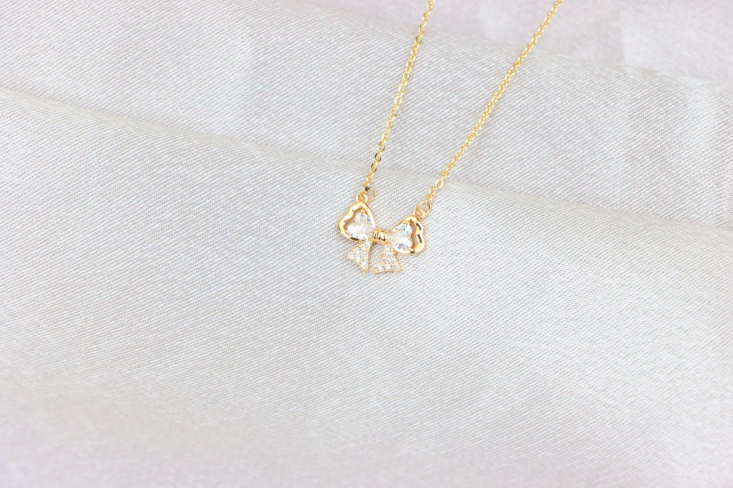 Rose Gold Bow Necklace with Heart-Shaped Crystals and Pavé Detail, XPNL1888 (2160-1)