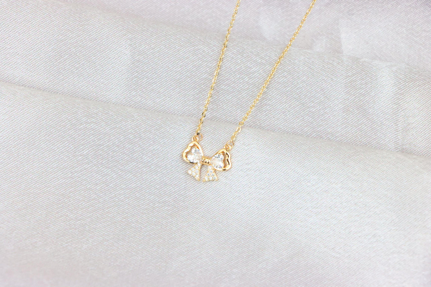 Rose Gold Bow Necklace with Heart-Shaped Crystals and Pavé Detail, XPNL1888 (2160-1)