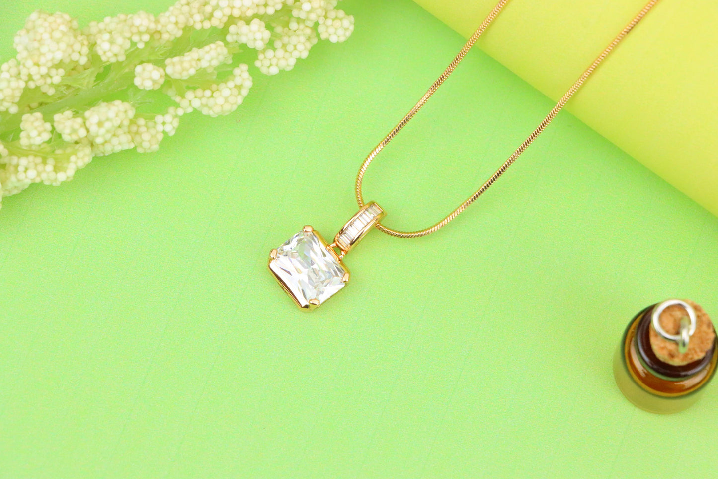 Elegant White Stone Pendant in Gold Finish with Baguette Detailing, XPPT1777 (2162-7)