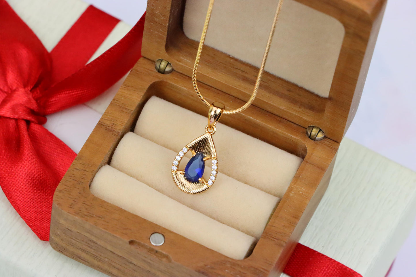 Elegant Blue Teardrop Pendant with Sparkling Accents and Gold Finish, XPPT1688 (2164-4)