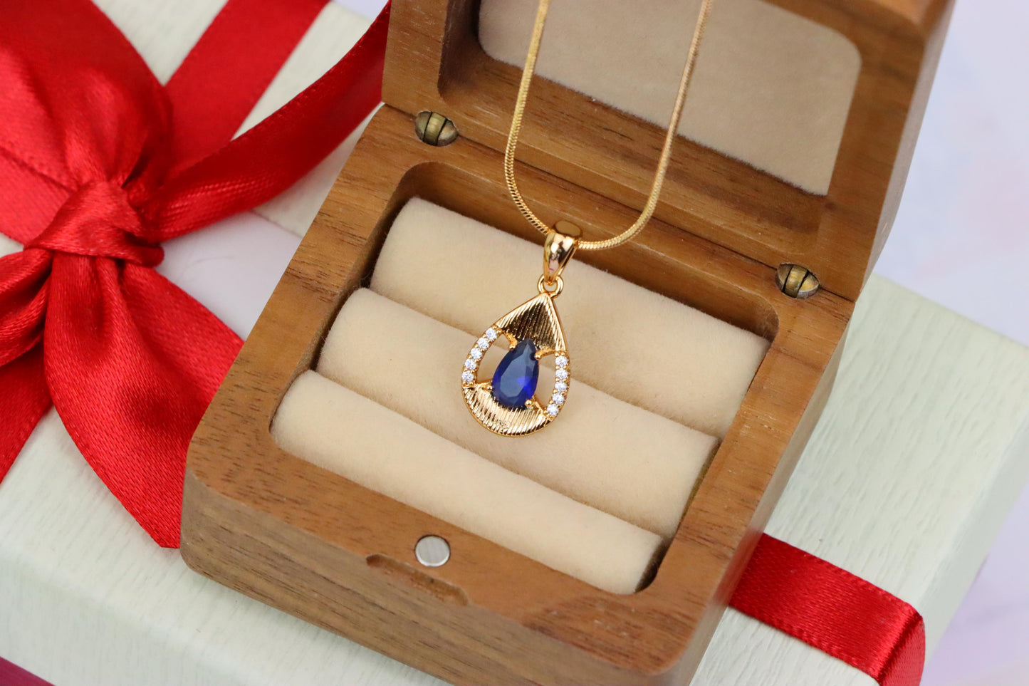 Elegant Blue Teardrop Pendant with Sparkling Accents and Gold Finish, XPPT1688 (2164-4)