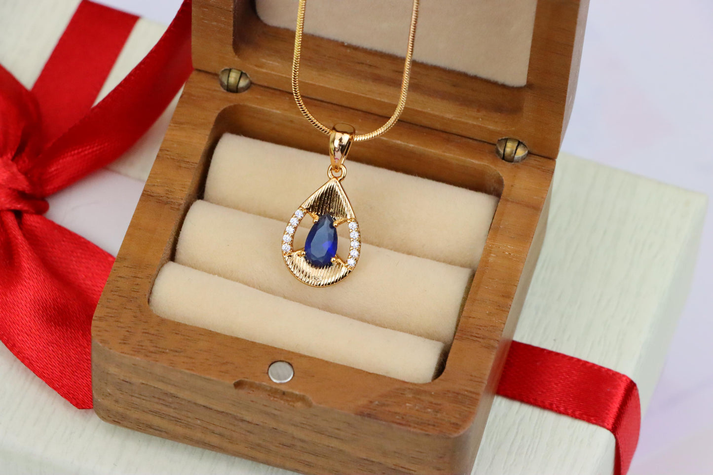 Elegant Blue Teardrop Pendant with Sparkling Accents and Gold Finish, XPPT1688 (2164-4)